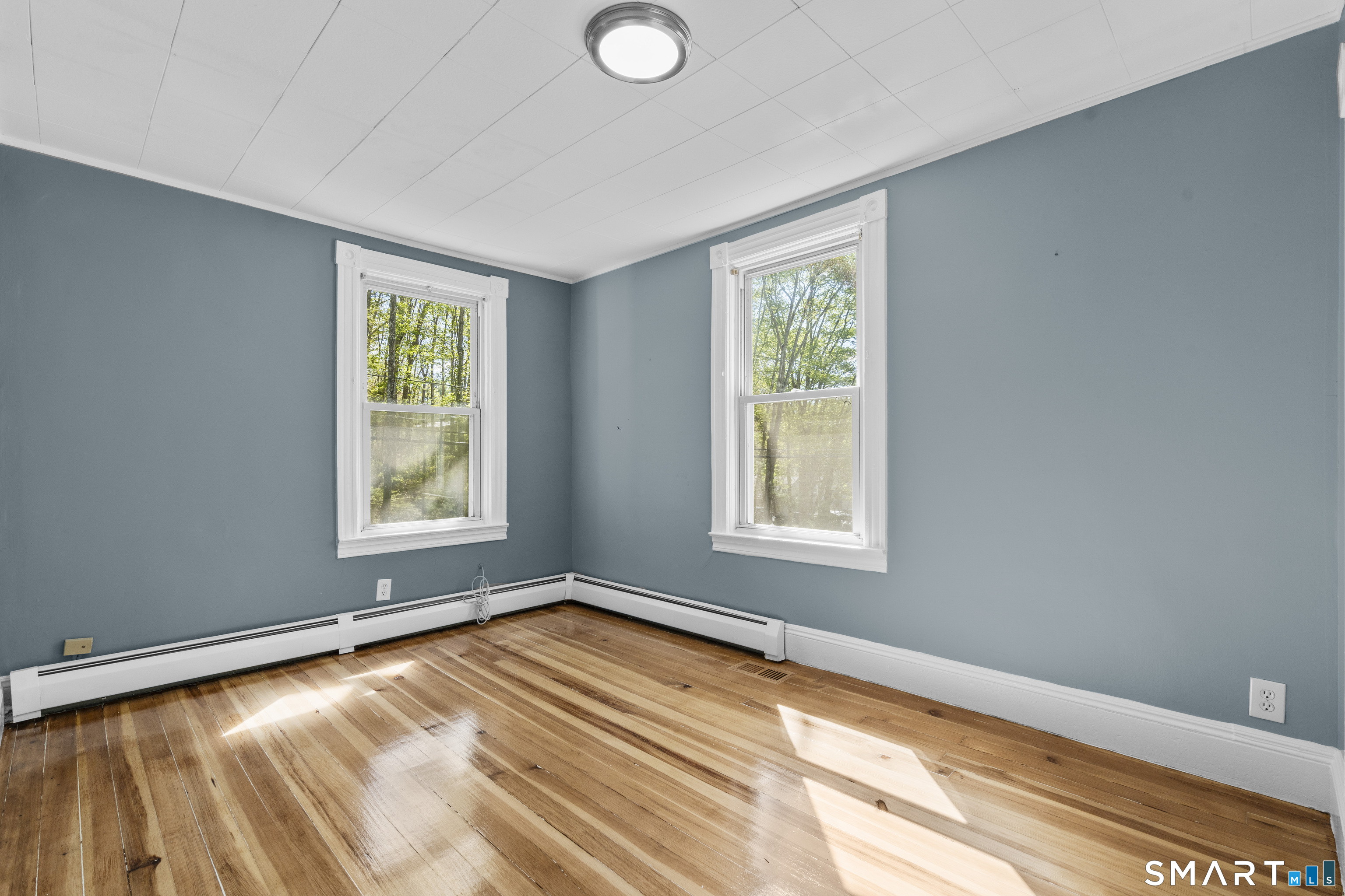 1847 Glasgo Road Griswold, CT 06351 - Photo 22 of 38 a view of an empty room with a window