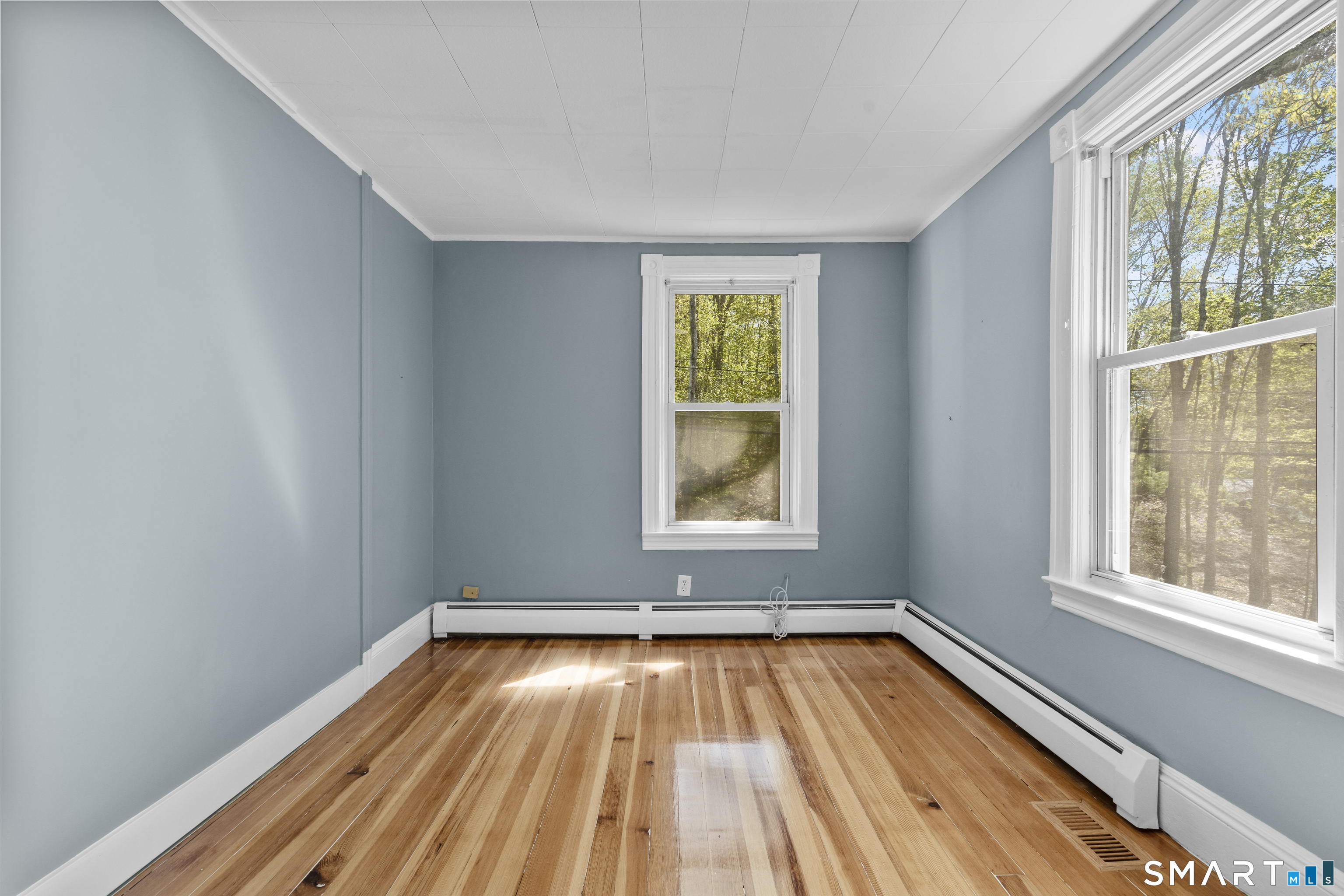 1847 Glasgo Road Griswold, CT 06351 - Photo 23 of 38 wooden floor in an empty room with a window