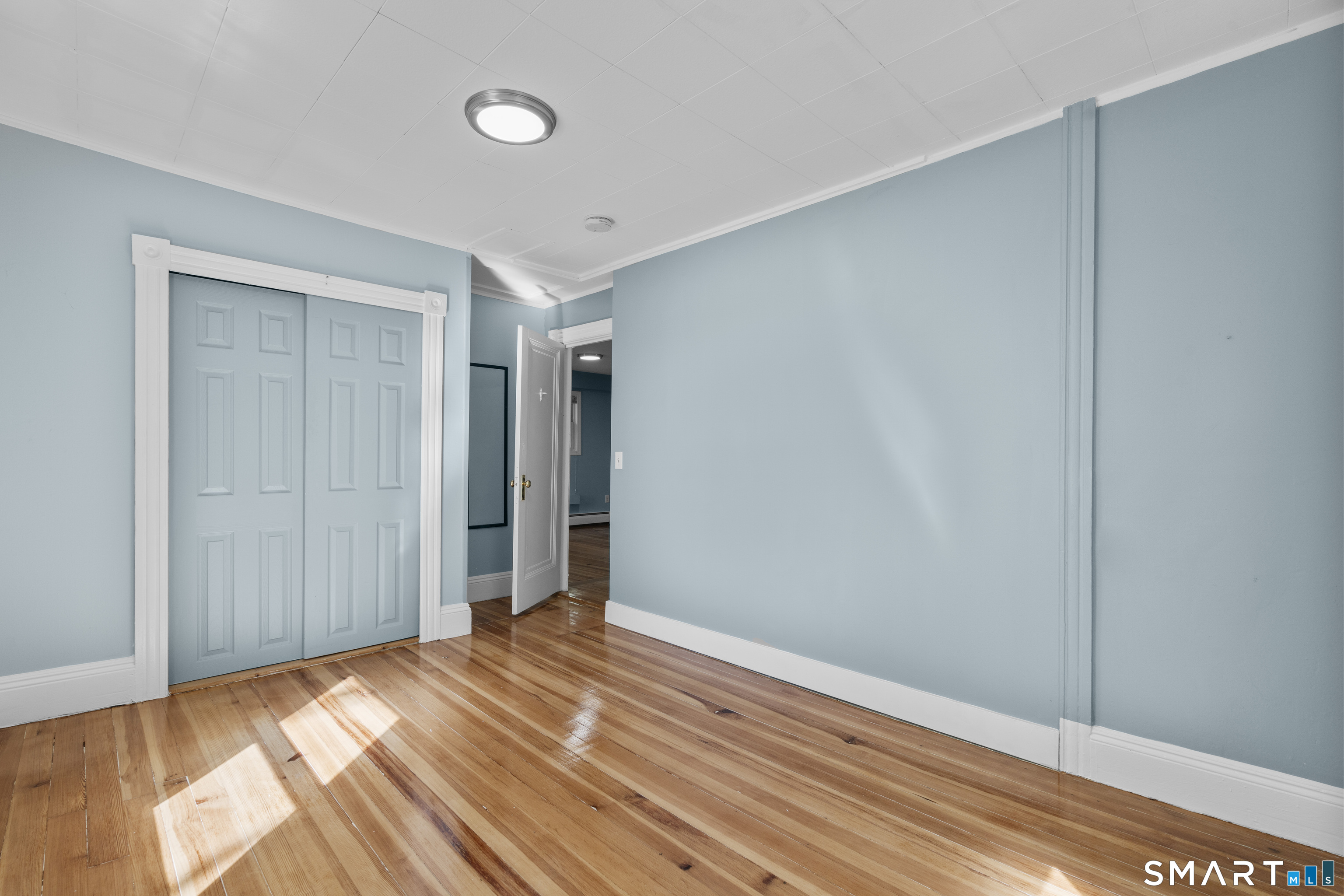 1847 Glasgo Road Griswold, CT 06351 - Photo 24 of 38 a view of a room with wooden floor