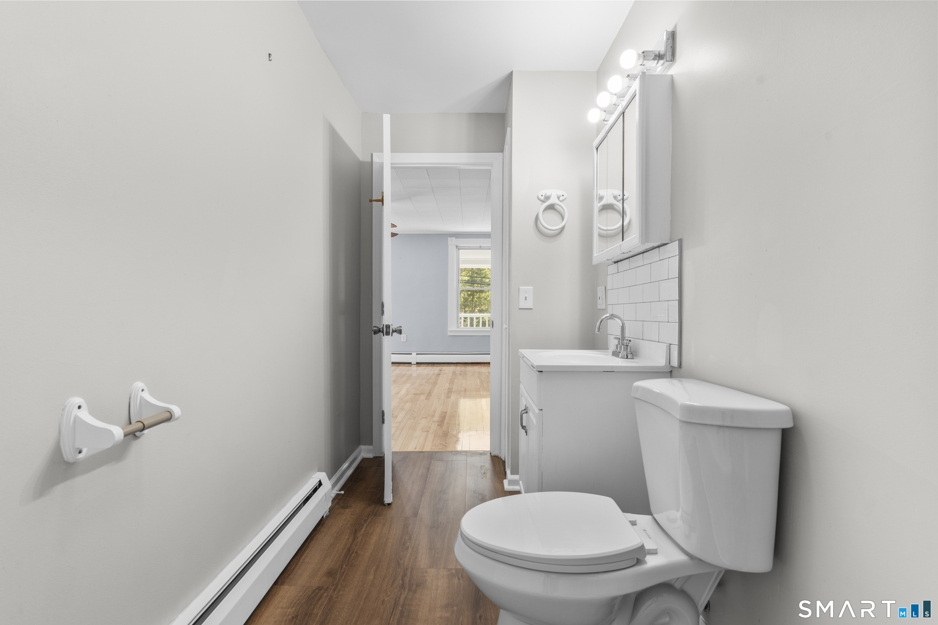 1847 Glasgo Road Griswold, CT 06351 - Photo 26 of 38 a white toilet sitting next to a bathroom sink