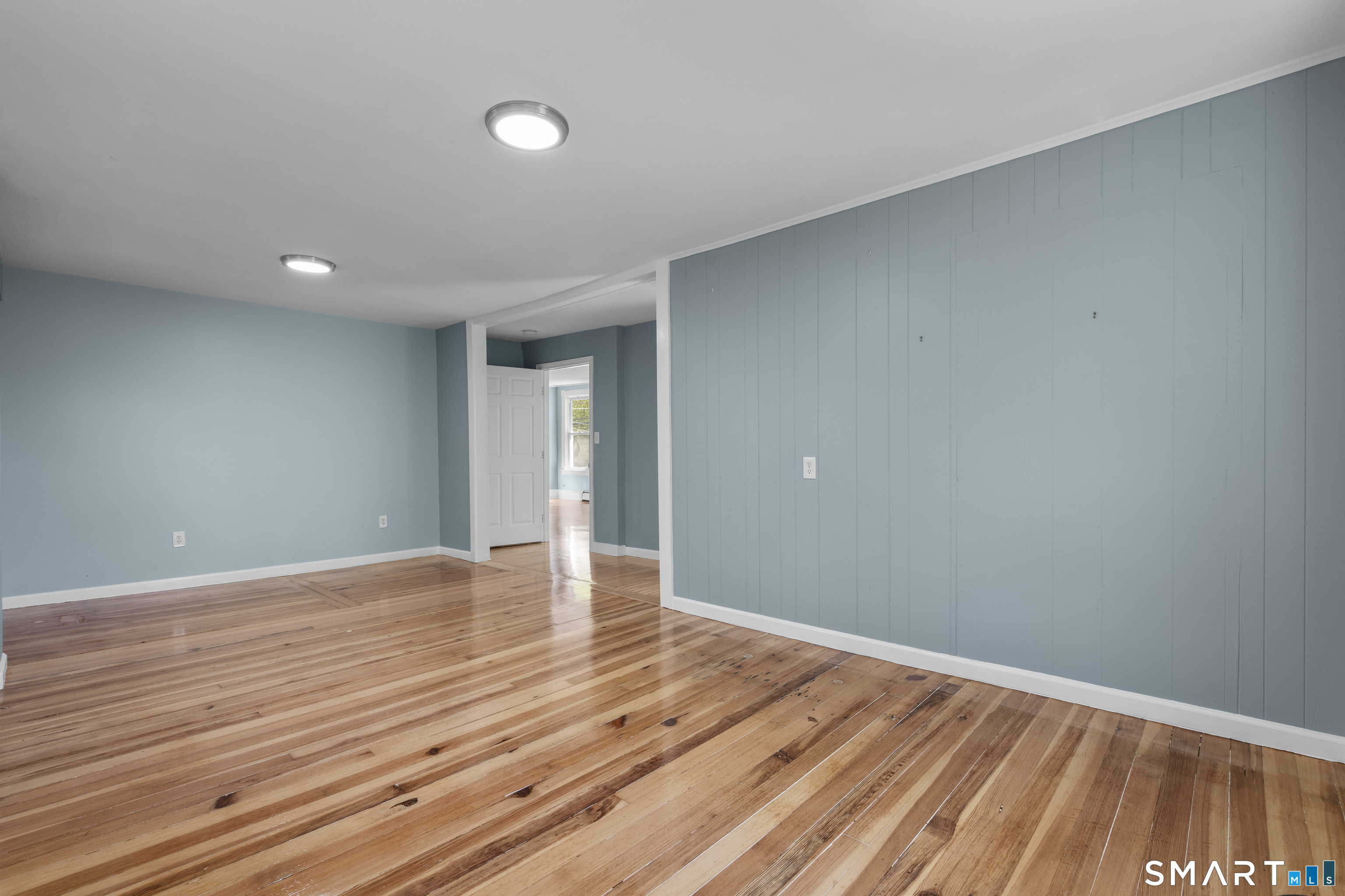 1847 Glasgo Road Griswold, CT 06351 - Photo 27 of 38 a view of an empty room with wooden floor