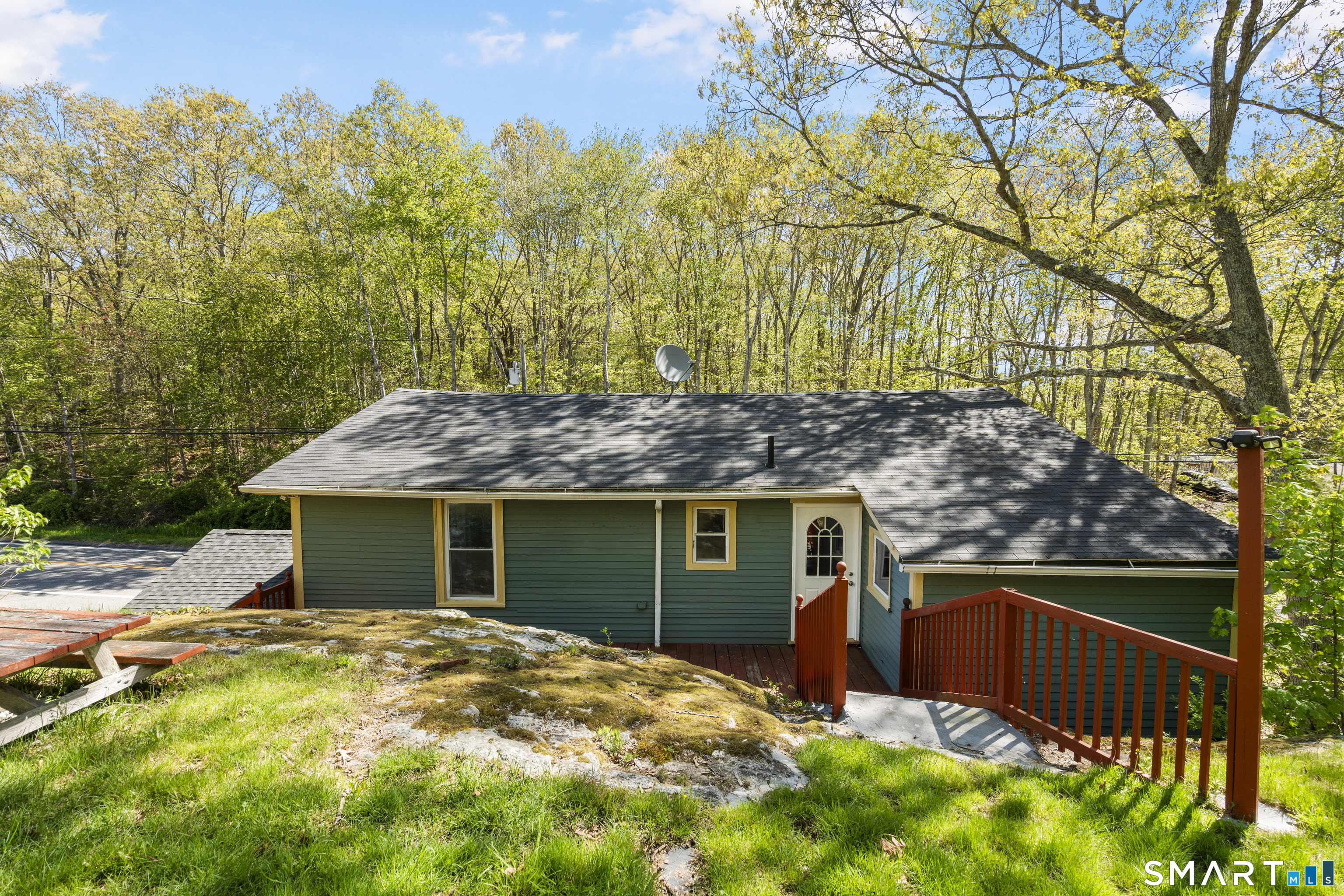 1847 Glasgo Road Griswold, CT 06351 - Photo 32 of 38 a backyard of a house with table and chairs
