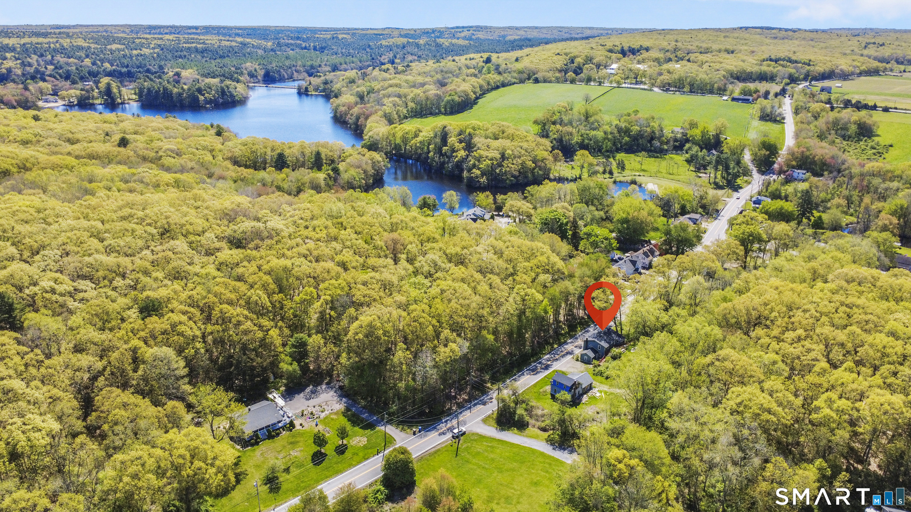 1847 Glasgo Road Griswold, CT 06351 - Photo 34 of 38 a view of a houses with a lush green forest