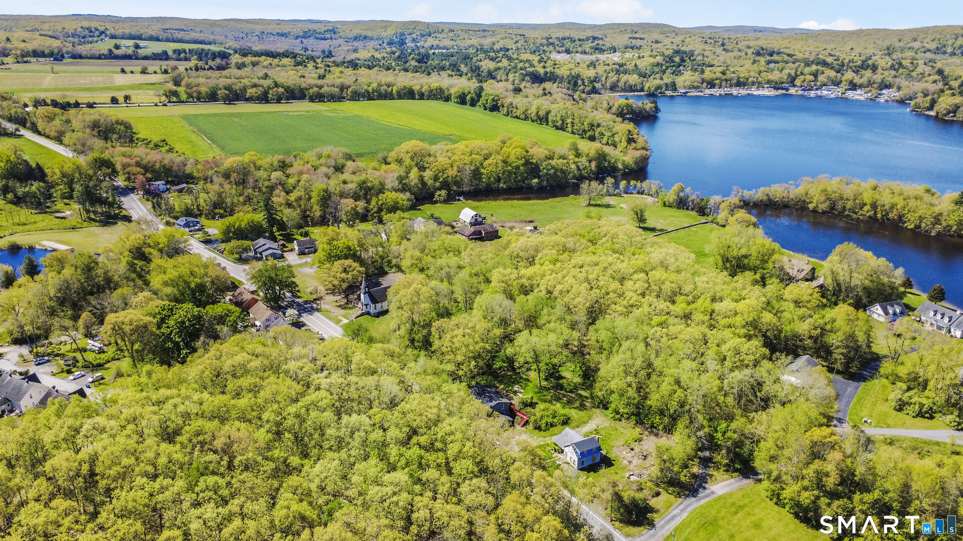 1847 Glasgo Road Griswold, CT 06351 - Photo 35 of 38 an aerial view of a houses with a lake and houses