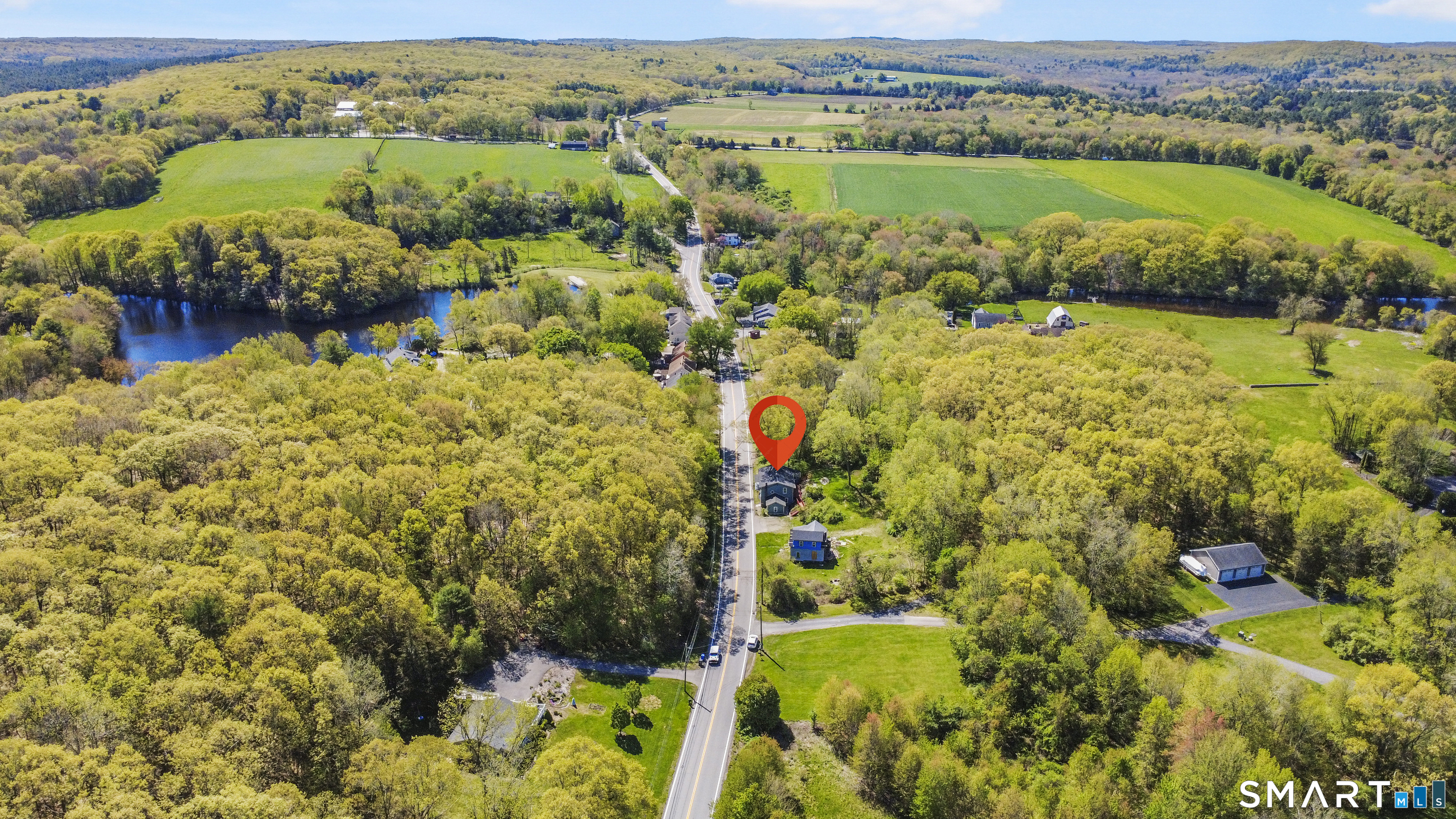 1847 Glasgo Road Griswold, CT 06351 - Photo 36 of 38 an aerial view of residential houses with outdoor space and river