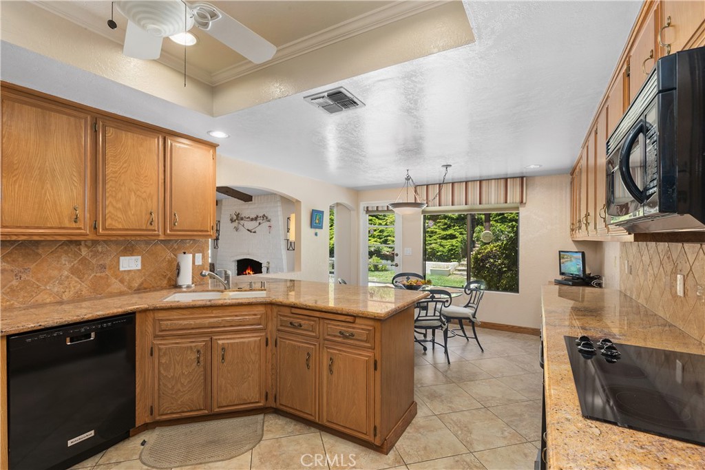 2376 North Vallejo Way Upland, CA 91784 - Photo 14 of 37 a kitchen with a sink and cabinets
