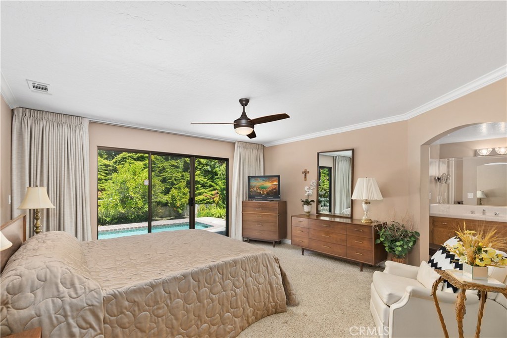 2376 North Vallejo Way Upland, CA 91784 - Photo 17 of 37 a spacious bedroom with a bed and large windows
