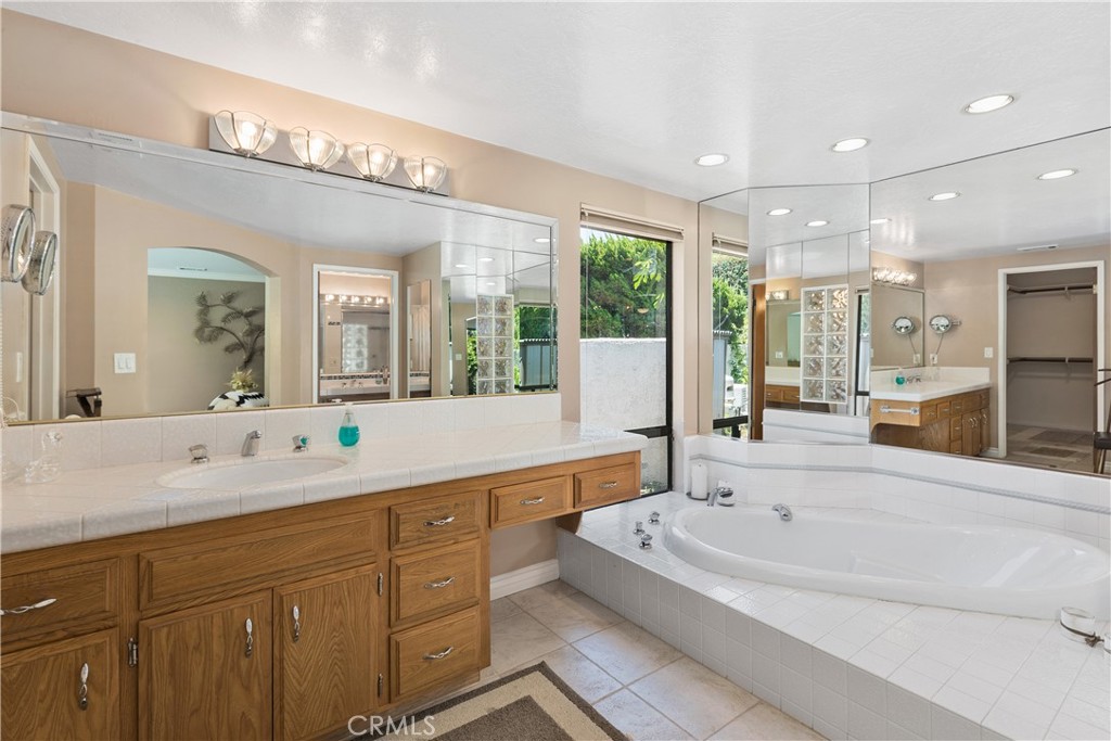 2376 North Vallejo Way Upland, CA 91784 - Photo 20 of 37 a spacious bathroom with a large tub sink and mirror