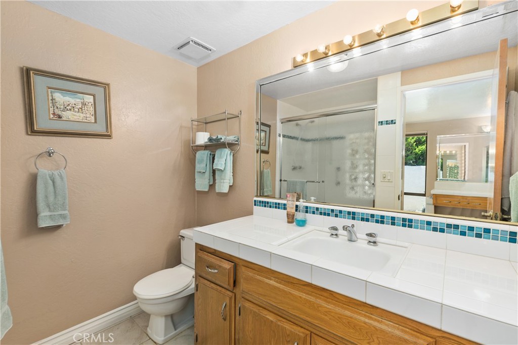 2376 North Vallejo Way Upland, CA 91784 - Photo 21 of 37 a bathroom with a sink and a mirror