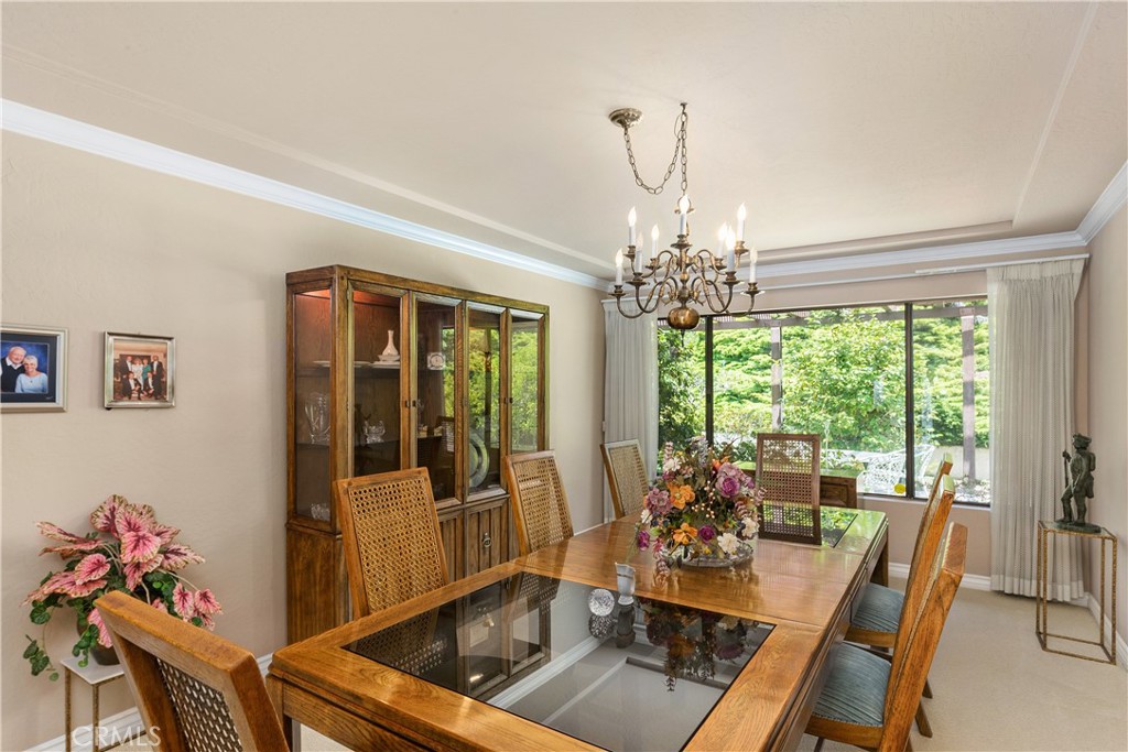 2376 North Vallejo Way Upland, CA 91784 - Photo 4 of 37 a view of a dining room with furniture large windows and wooden floor