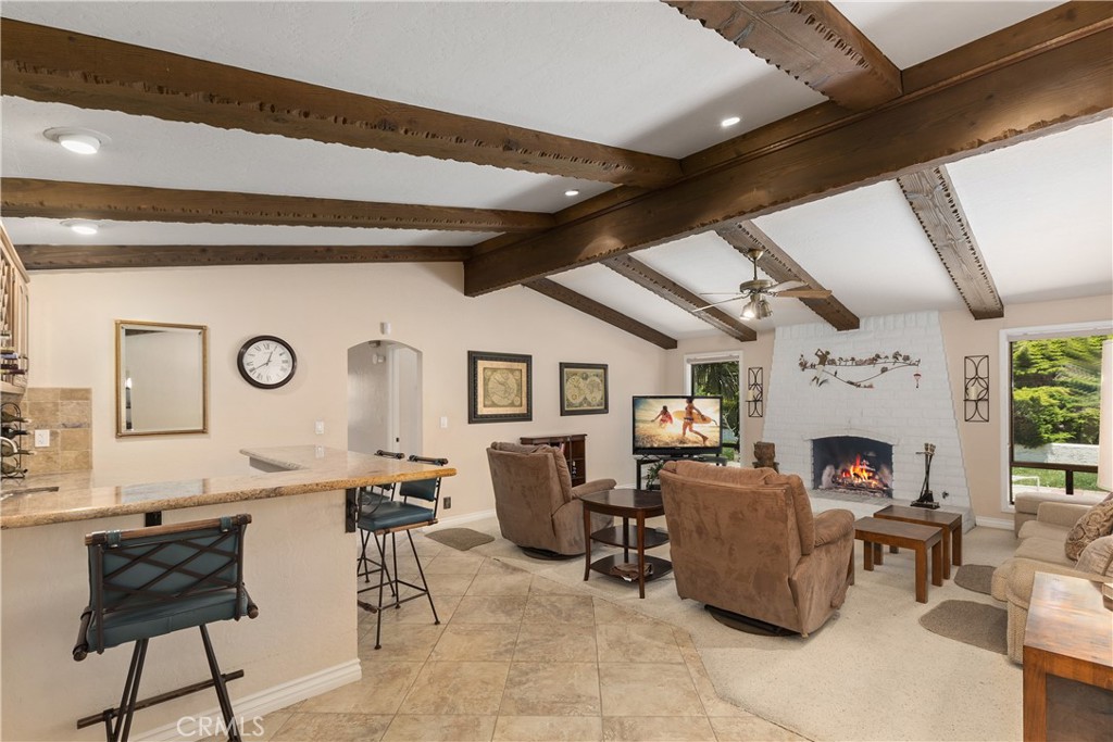 2376 North Vallejo Way Upland, CA 91784 - Photo 8 of 37 a living room with fireplace furniture and a large window