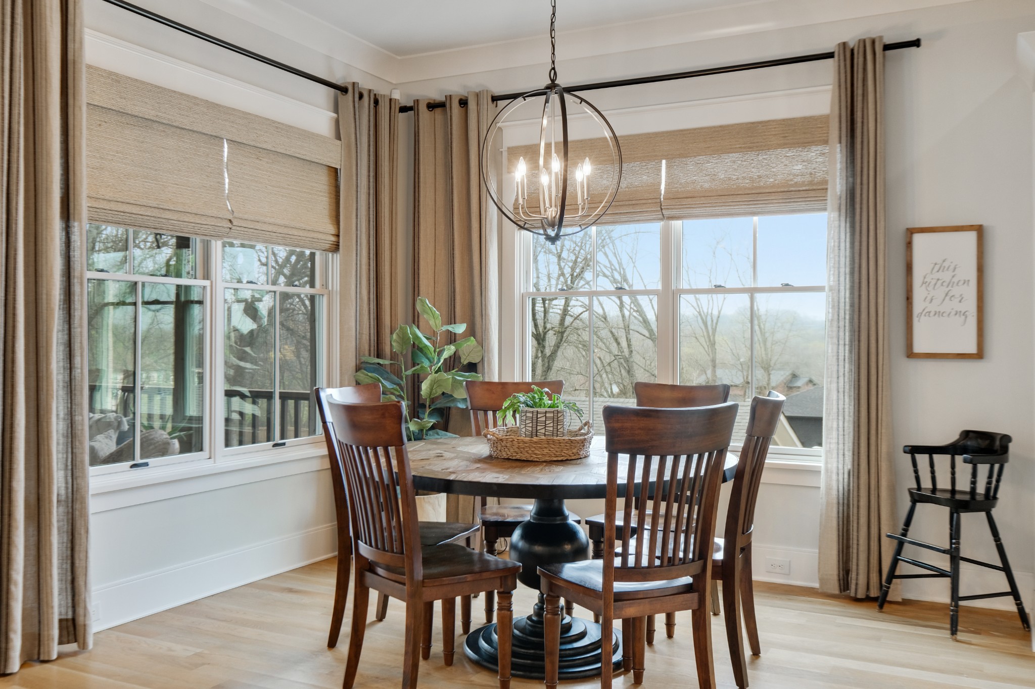 3003 Hobbs Road, Unit B Nashville, TN 37215 - Photo 18 of 70 a dining room with furniture a chandelier and wooden floor