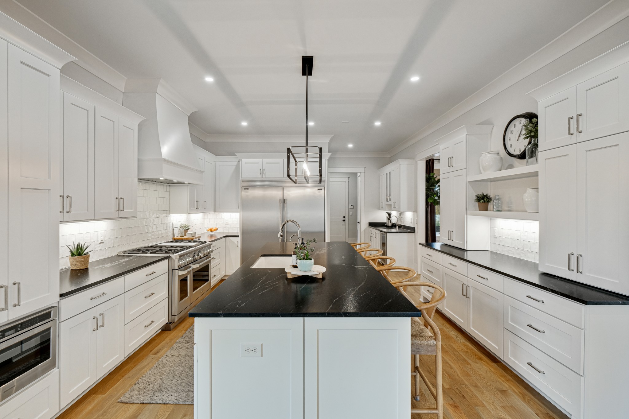 3003 Hobbs Road, Unit B Nashville, TN 37215 - Photo 21 of 70 a kitchen with a sink a stove and chairs