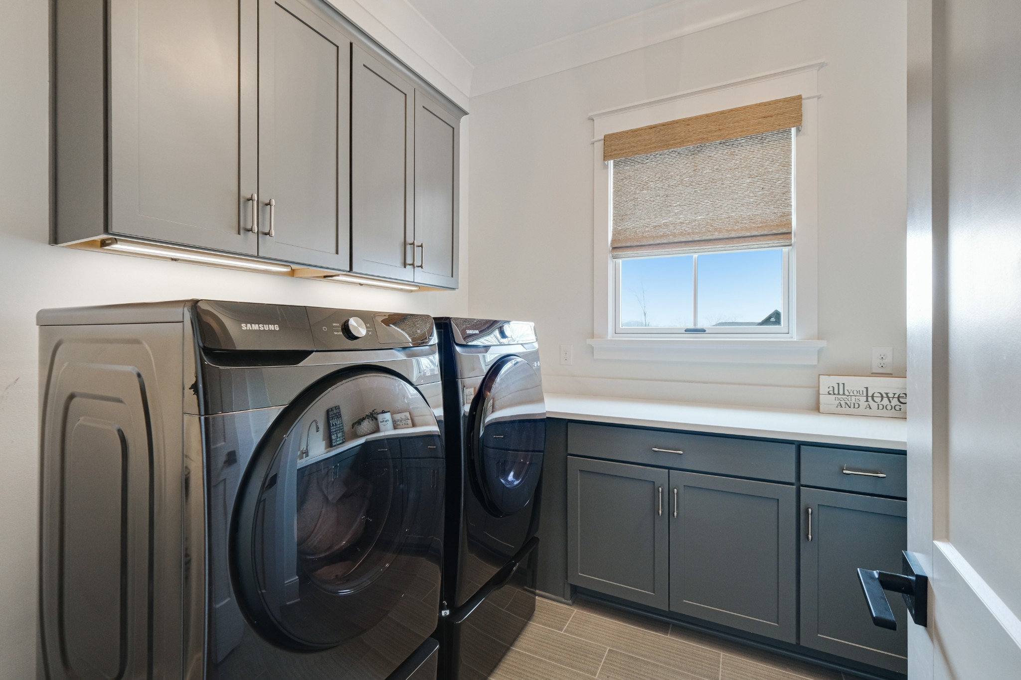3003 Hobbs Road, Unit B Nashville, TN 37215 - Photo 29 of 70 a utility room with cabinets washer and dryer