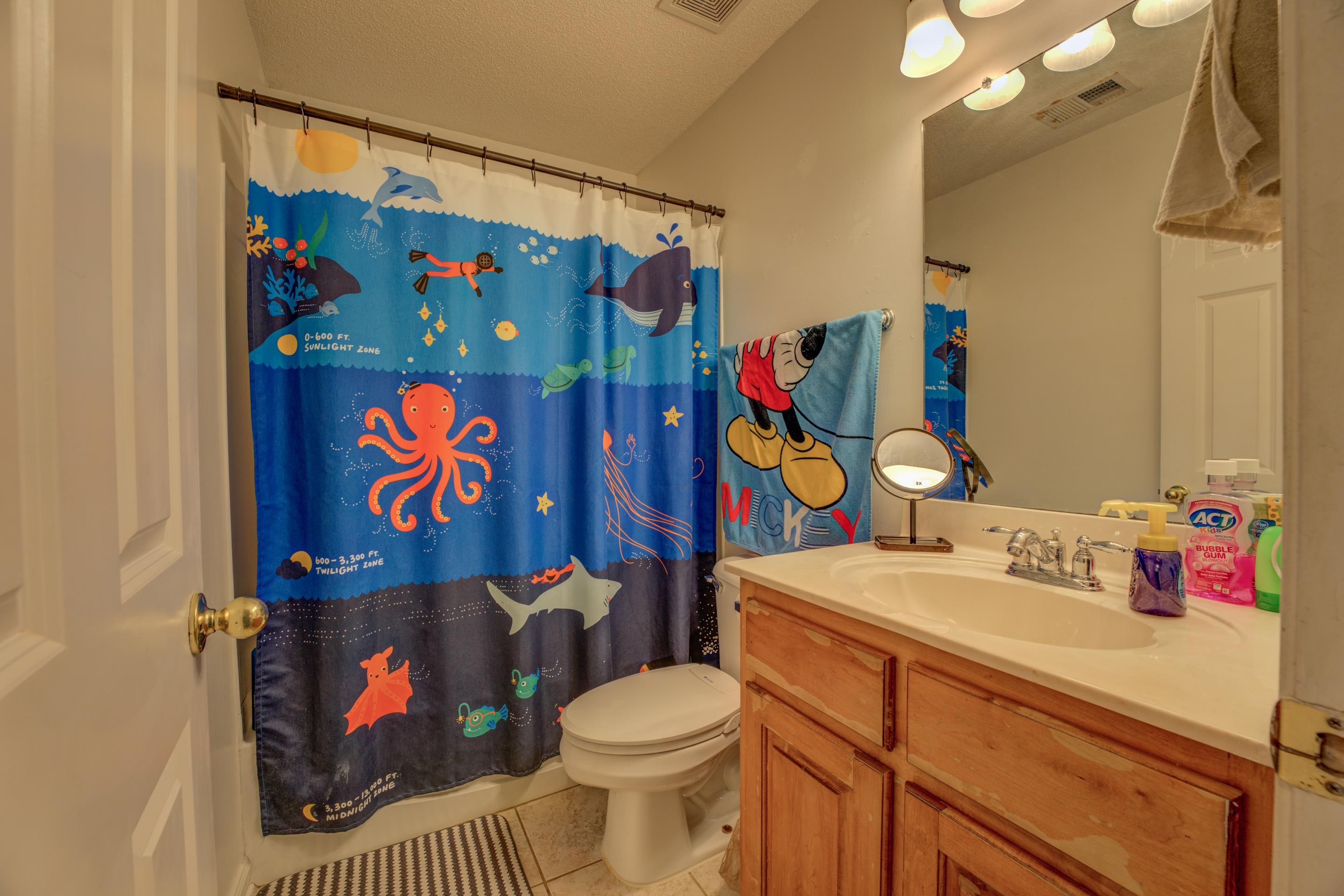 11668 Millwind Drive Arlington, TN 38002 - Photo 12 of 22 a bathroom with a sink toilet and vanity