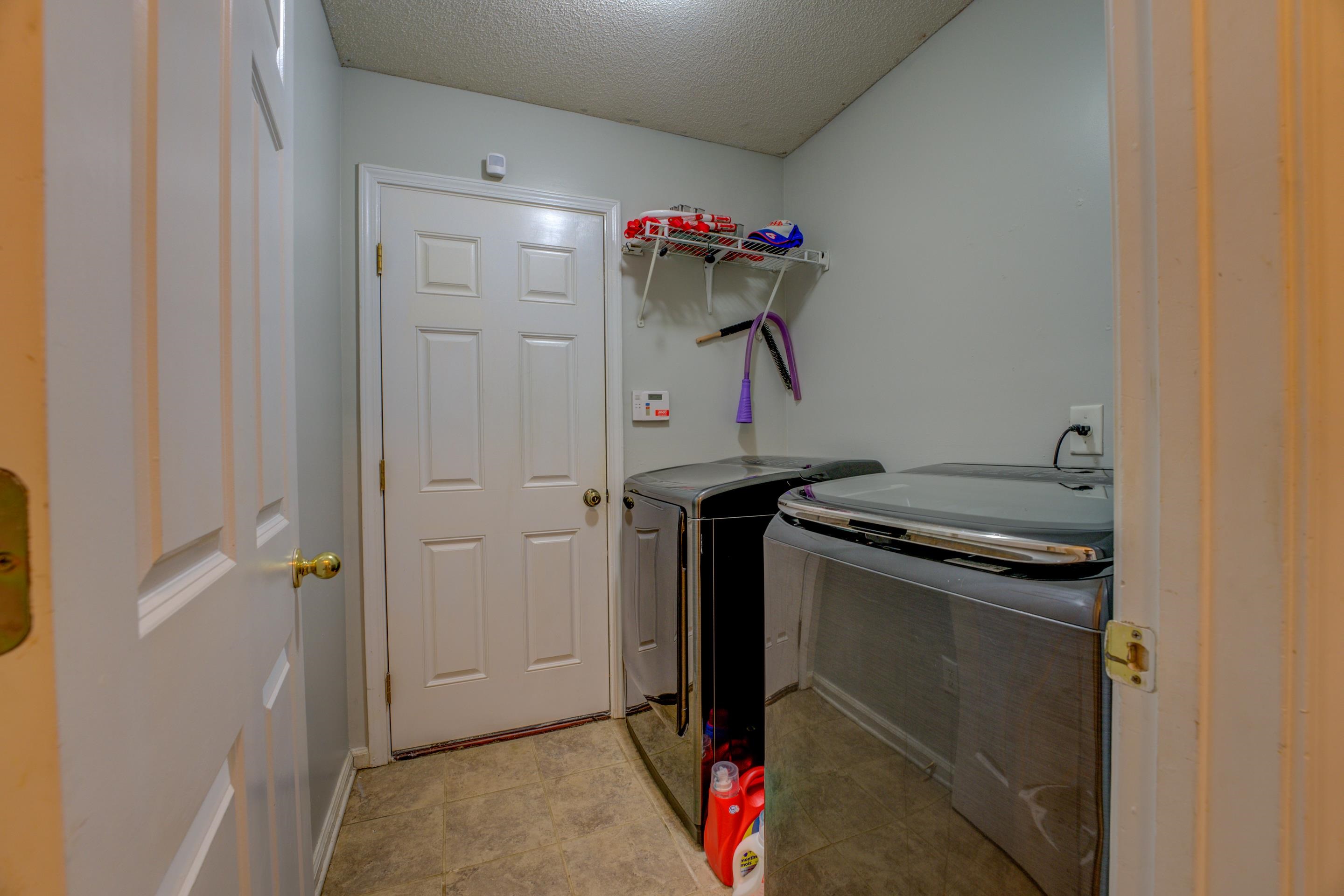 11668 Millwind Drive Arlington, TN 38002 - Photo 16 of 22 a utility room with dryer and washer