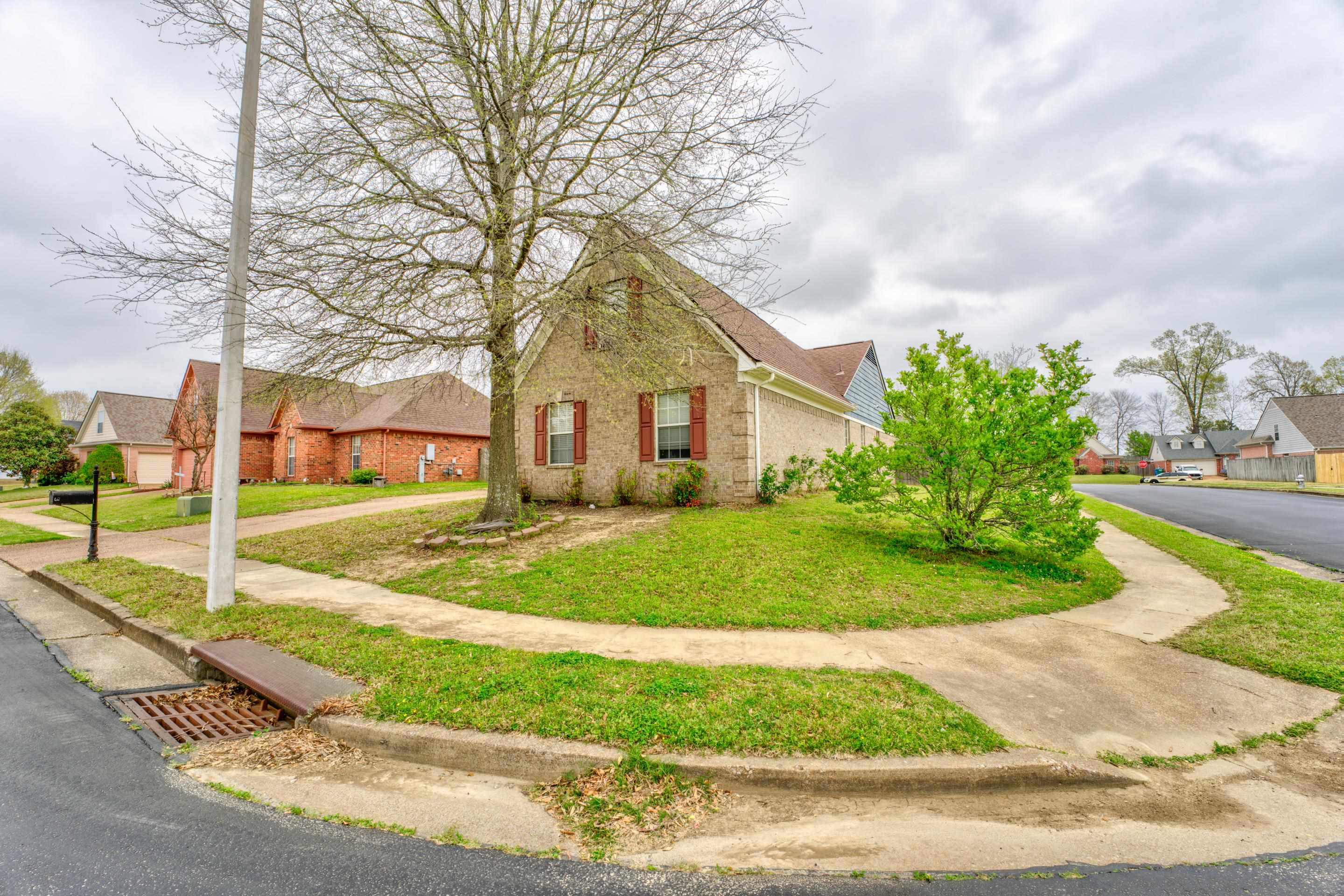 11668 Millwind Drive Arlington, TN 38002 - Photo 17 of 22 a front view of a house with a yard and garage