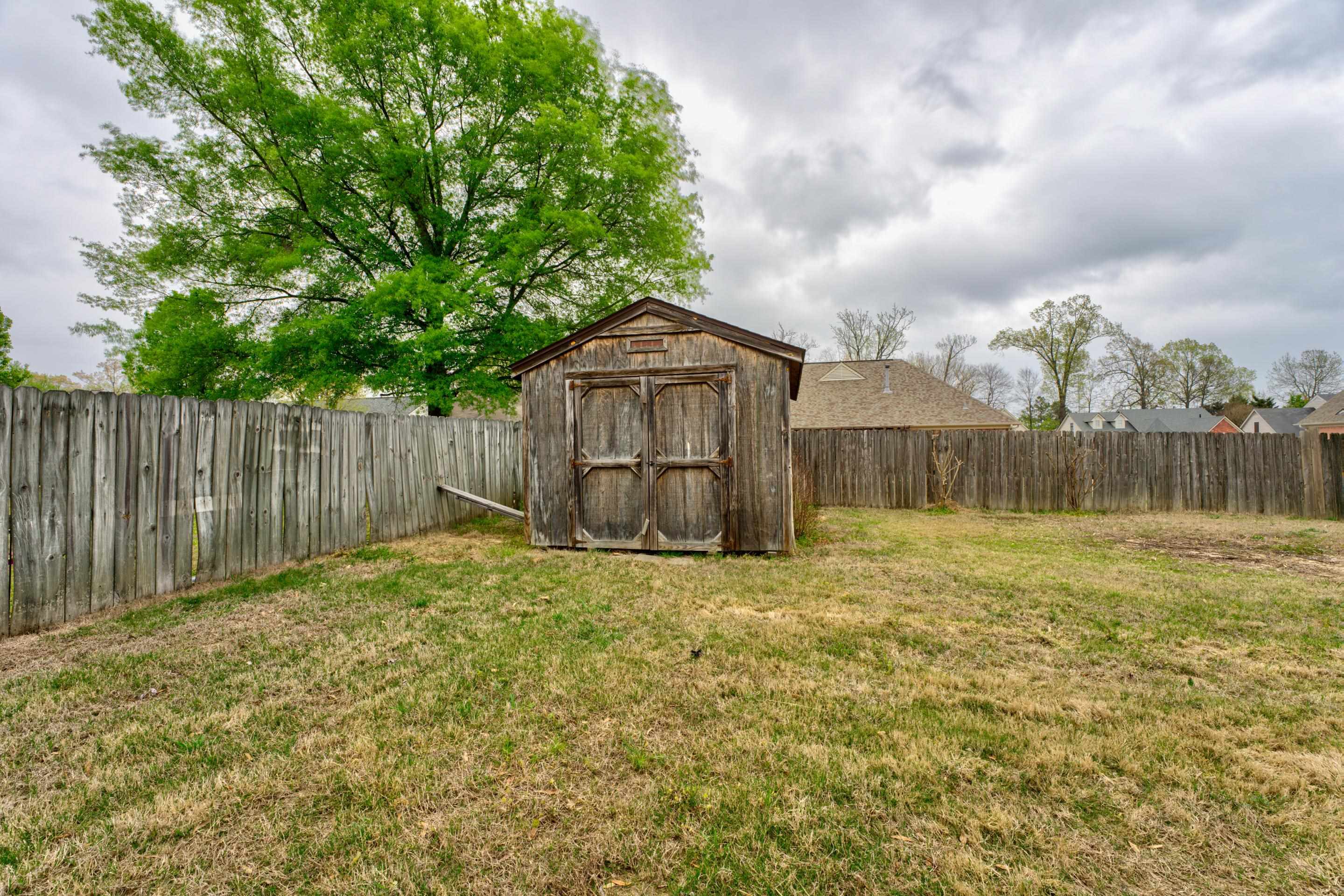 11668 Millwind Drive Arlington, TN 38002 - Photo 20 of 22 a backyard of a house