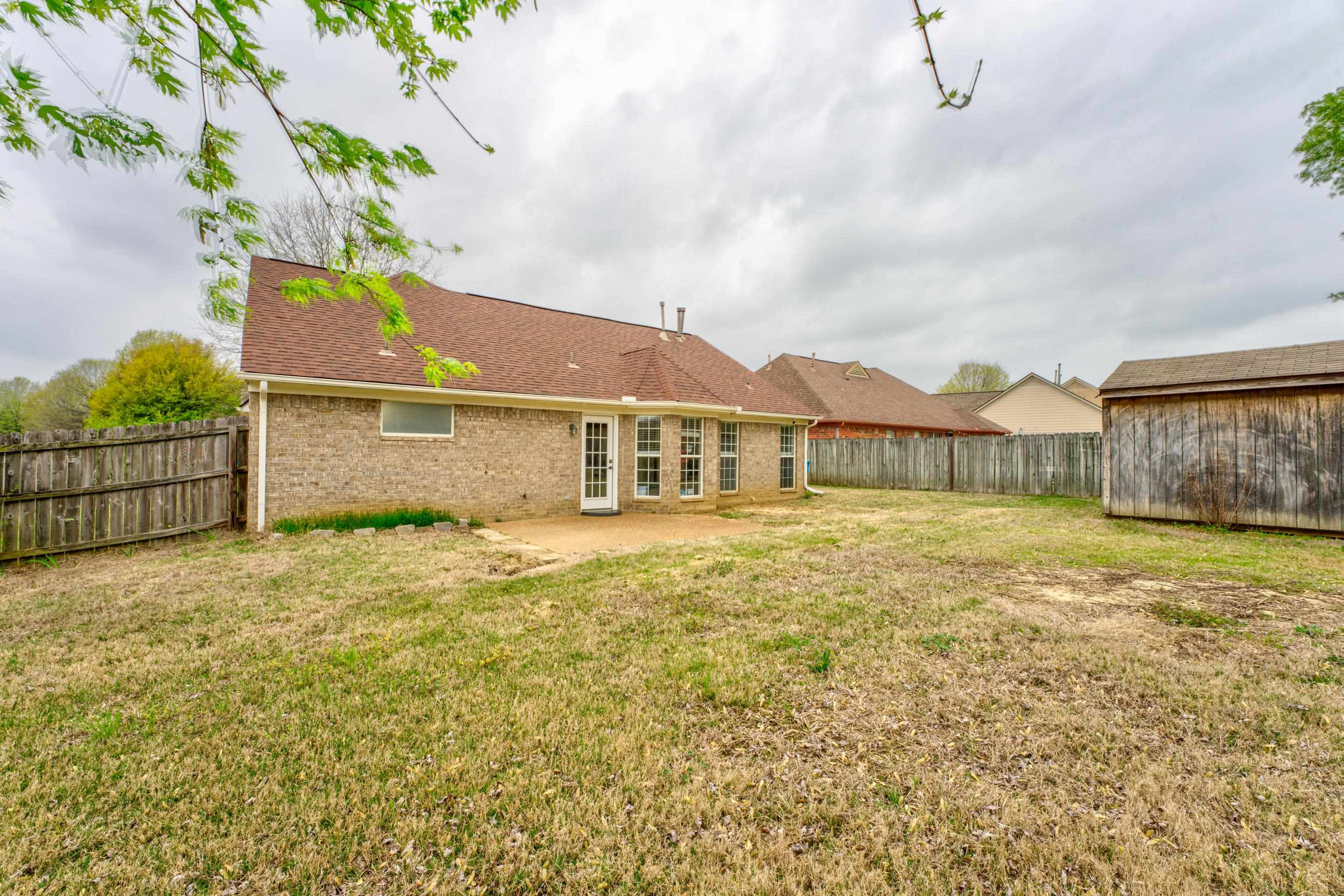 11668 Millwind Drive Arlington, TN 38002 - Photo 21 of 22 a front view of a house with a garden