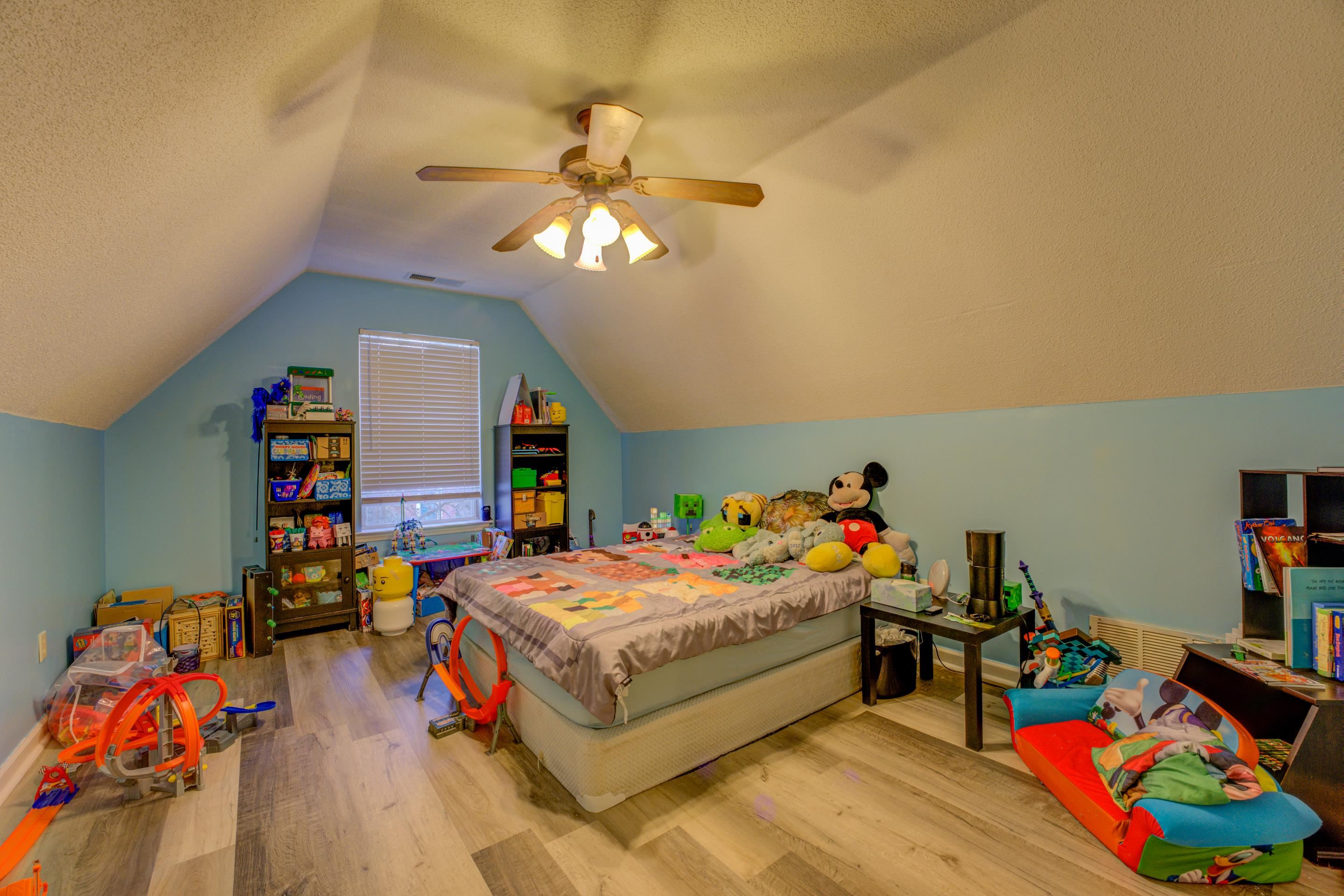 11668 Millwind Drive Arlington, TN 38002 - Photo 7 of 22 a bed room with a bed and a wooden floor