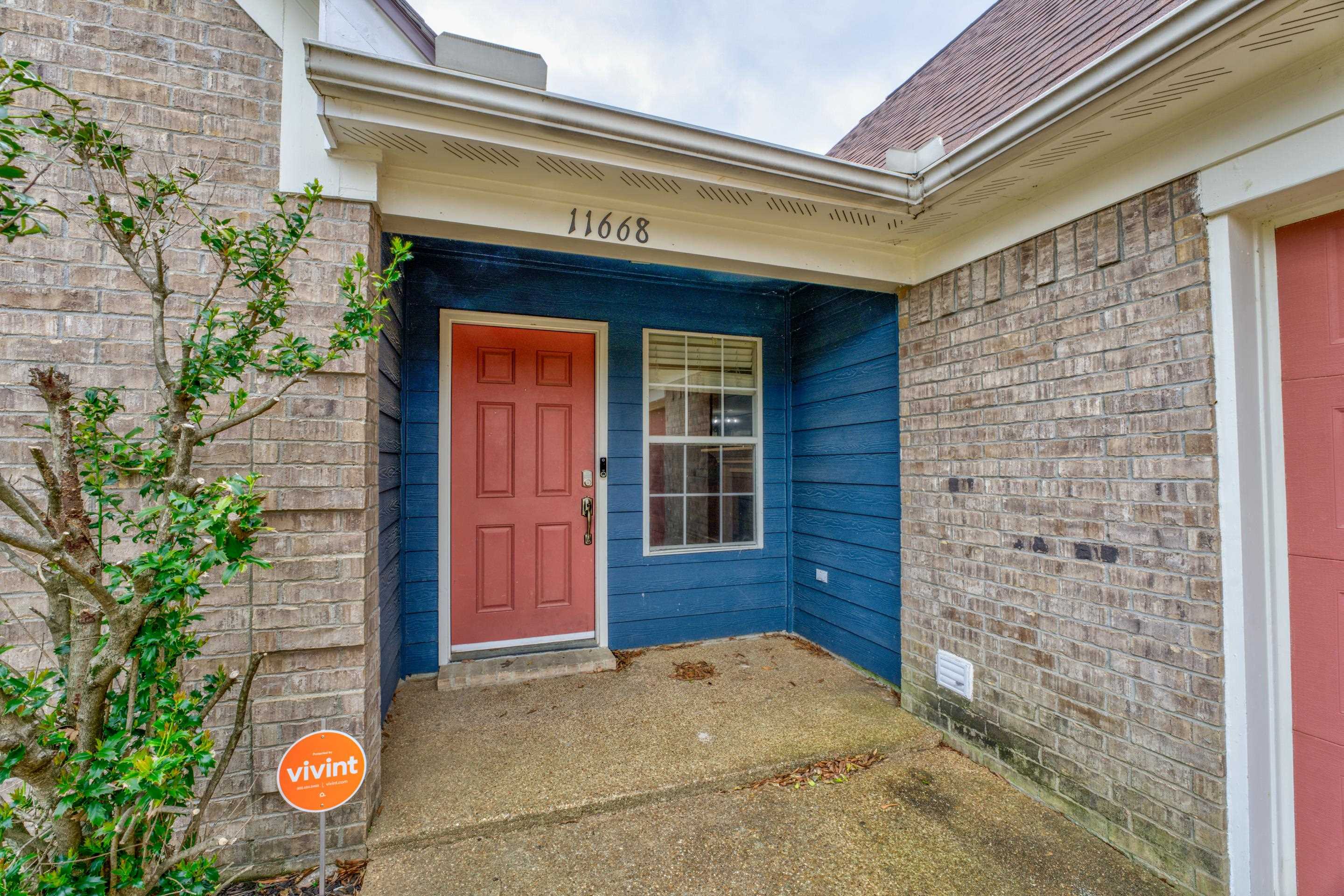 11668 Millwind Drive Arlington, TN 38002 - Photo 8 of 22 a front view of a house with large windows