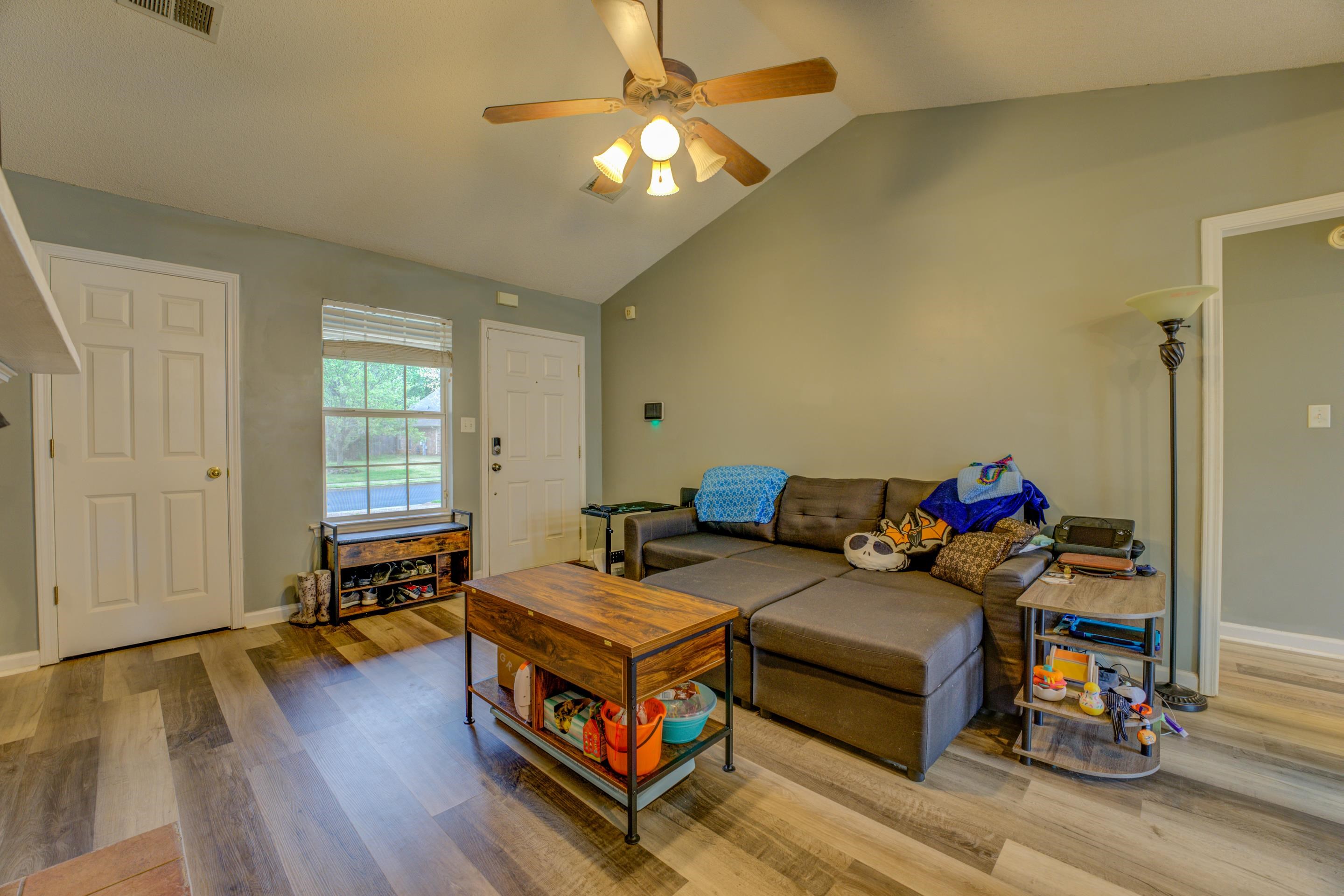 11668 Millwind Drive Arlington, TN 38002 - Photo 9 of 22 a living room with furniture and a wooden floor