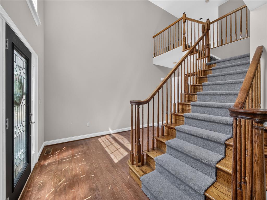 3821 Rittenhouse Road Lower Macungie Township, PA 18062 - Photo 19 of 62 A grand entryway welcomes with rich hardwood flooring and a gracefully ascending staircase.