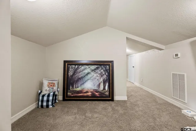 a view of an empty room and fire place