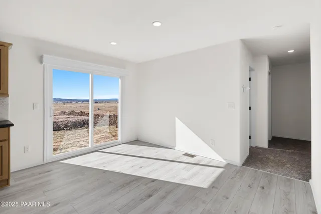 a kitchen with stainless steel appliances granite countertop a sink stove and microwave