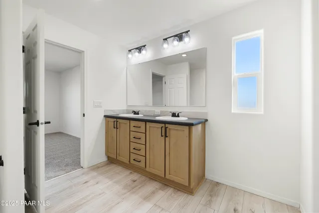 an empty room with closet and windows