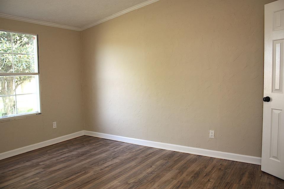 5128 Starks Road Cross Plains, TN 37049 - Photo 16 of 17 an empty room with wooden floor and windows