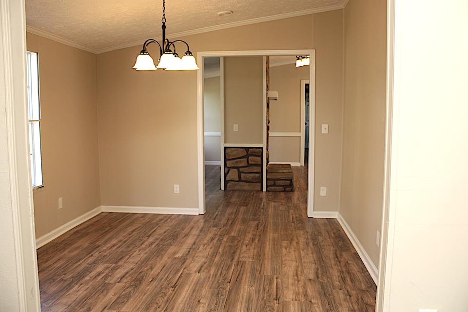 5128 Starks Road Cross Plains, TN 37049 - Photo 3 of 17 a view of a room with wooden floor staircase and a bathroom