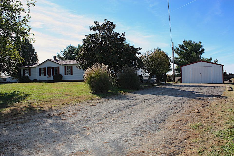 5128 Starks Road Cross Plains, TN 37049 - Photo 6 of 17 a view of a house with backyard and tree