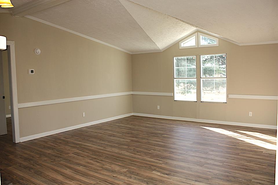 5128 Starks Road Cross Plains, TN 37049 - Photo 8 of 17 an empty room with wooden floor and windows
