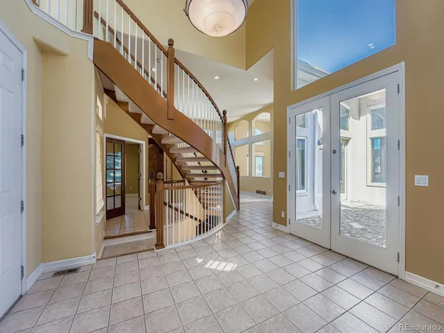 a view of entryway and hall with a front door