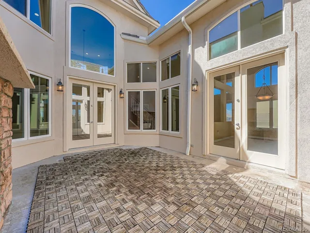 a view of a brick house with a large windows