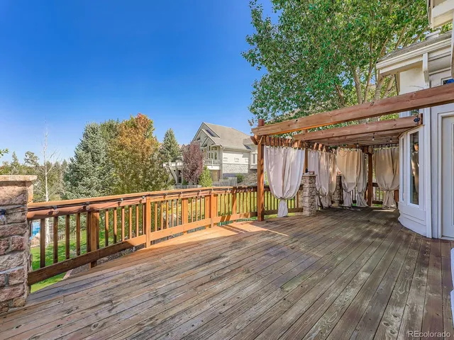 a view of a house with wooden deck