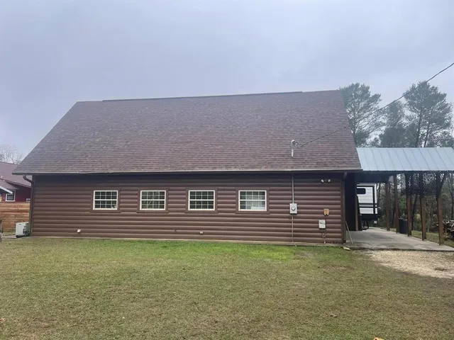 a front view of a house with a yard
