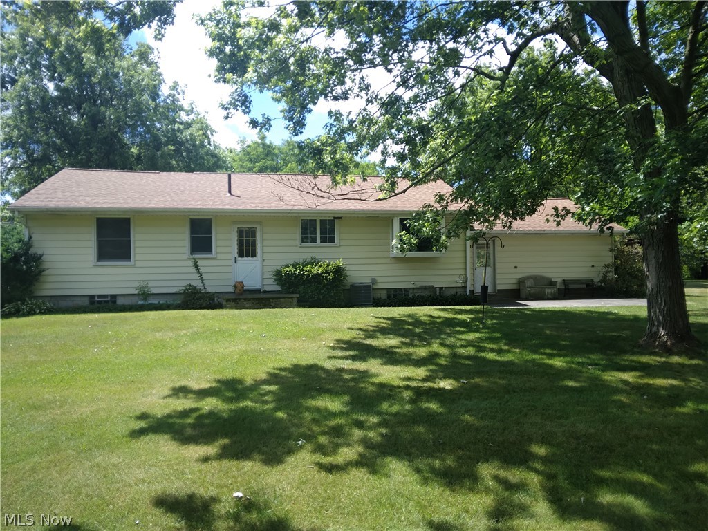 97 Narrows Road Painesville, OH 44077 - Photo 27 of 45 View of front facade with a front yard and central AC