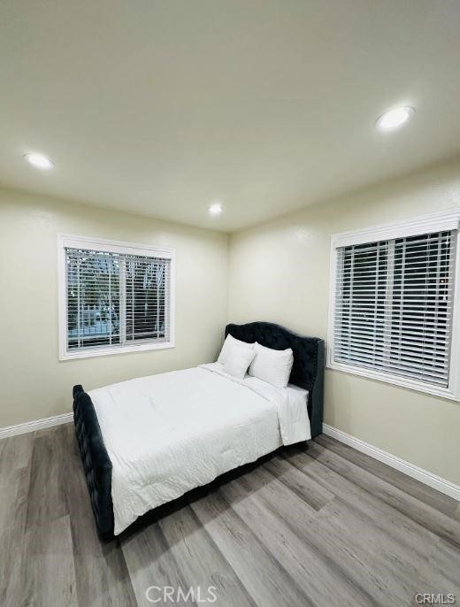 8952 McClure Avenue Westminster, CA 92683 - Photo 3 of 10 a bedroom with a bed and wooden floor