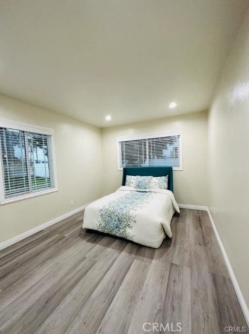 8952 McClure Avenue Westminster, CA 92683 - Photo 4 of 10 a bed sitting in a bedroom next to a window