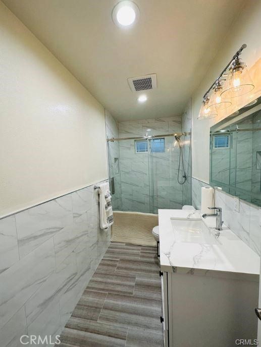 8952 McClure Avenue Westminster, CA 92683 - Photo 5 of 10 a bathroom with a sink and mirror