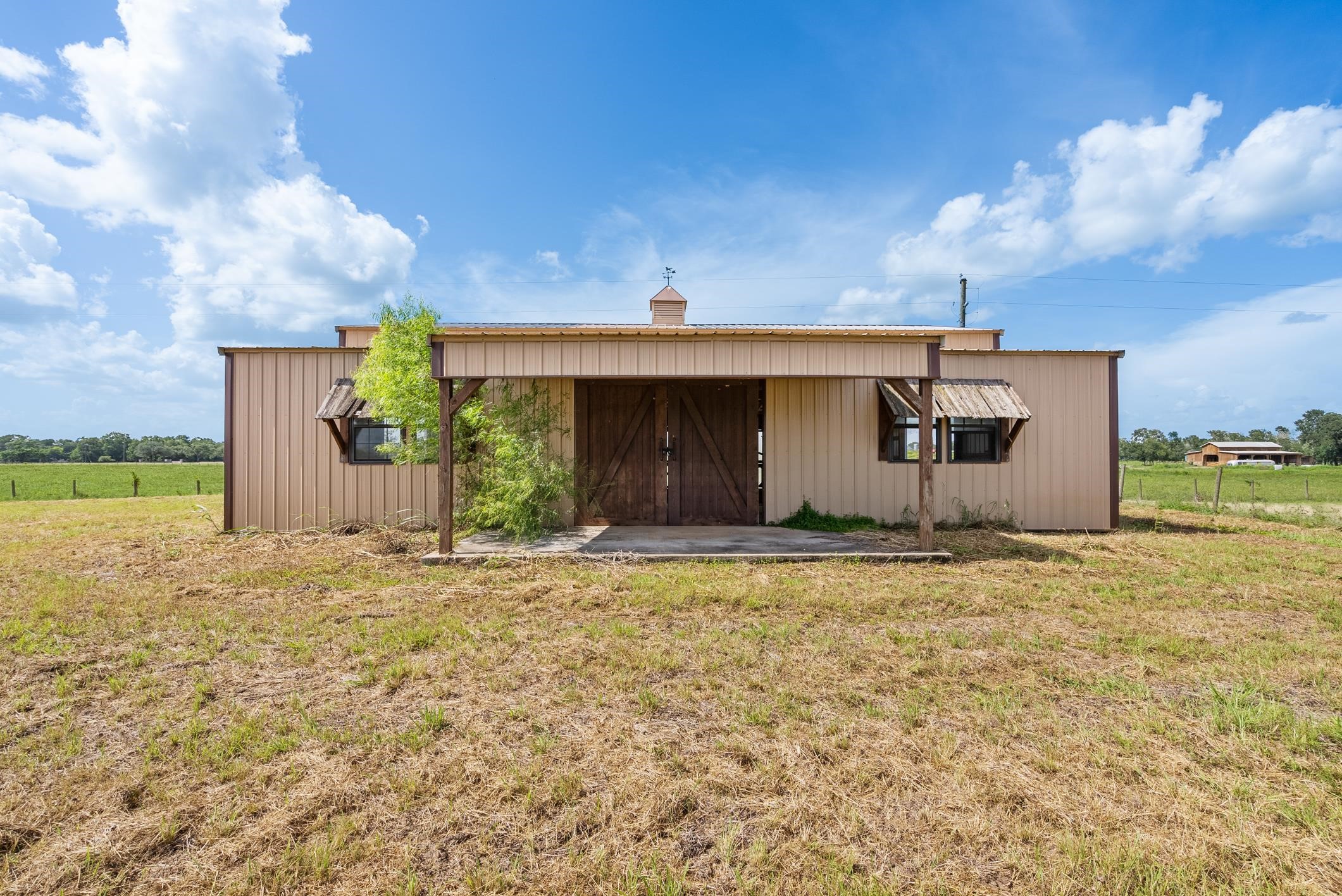Tbd Guyler Road Wallis, TX 77485 - Photo 23 of 33 a front view of a house with a yard and garage