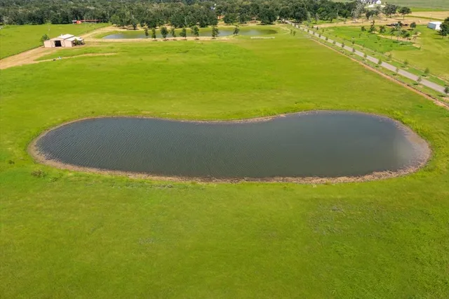 a view of an swimming pool with a yard