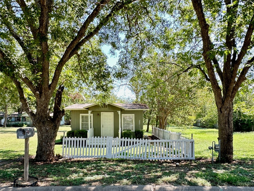 2021 Pecan Street Bastrop, TX 78602 - Photo 1 of 1 a view of a house with a garden