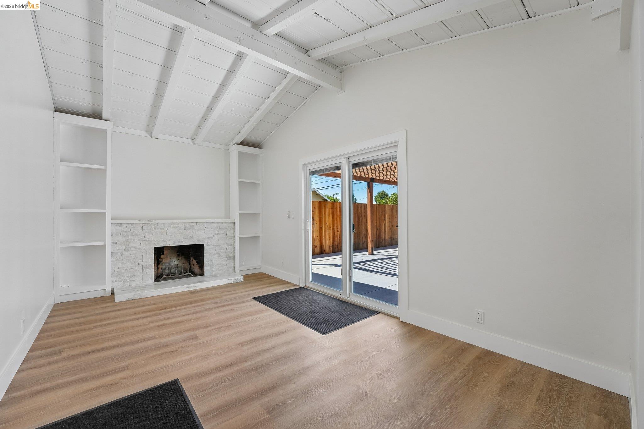375 Senter Road San Jose, CA 95111 - Photo 16 of 80 a view of a livingroom with wooden floor and a fireplace
