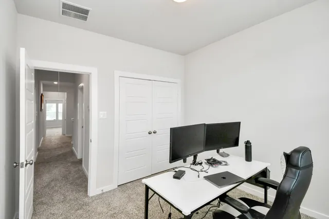 a view of a workspace with furniture