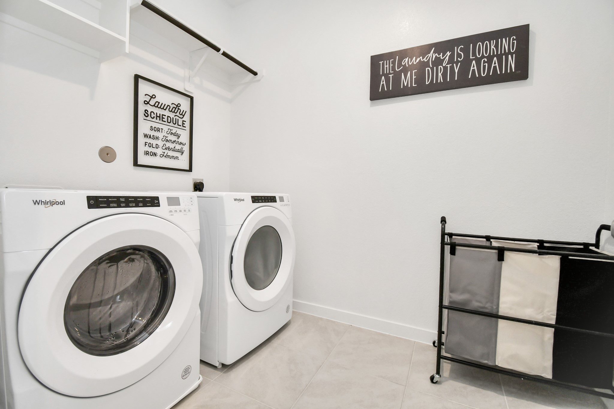 8213 Rising Stream Drive Houston, TX 77063 - Photo 17 of 21 a utility room with dryer and washer