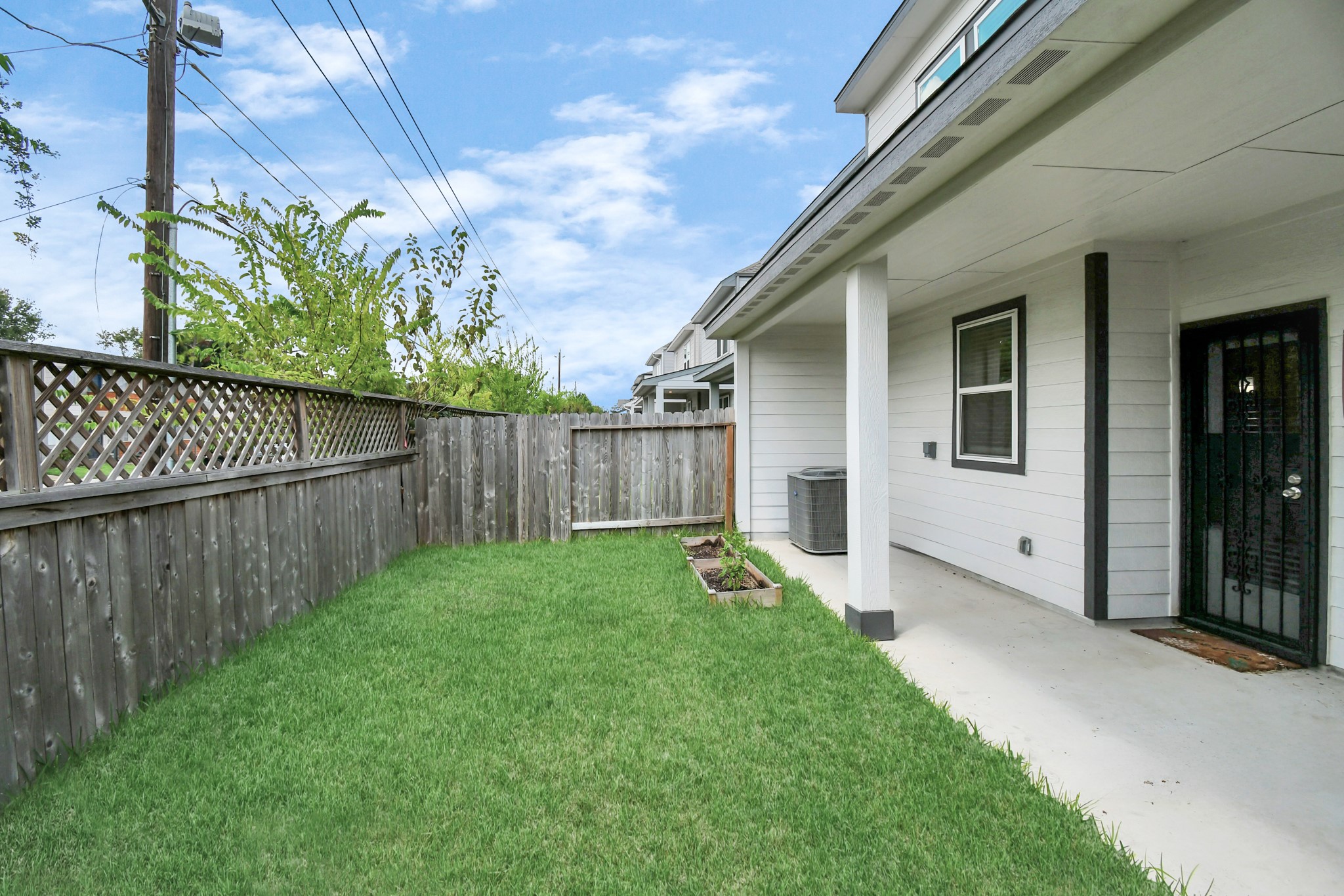8213 Rising Stream Drive Houston, TX 77063 - Photo 19 of 21 a view of a backyard with wooden fence
