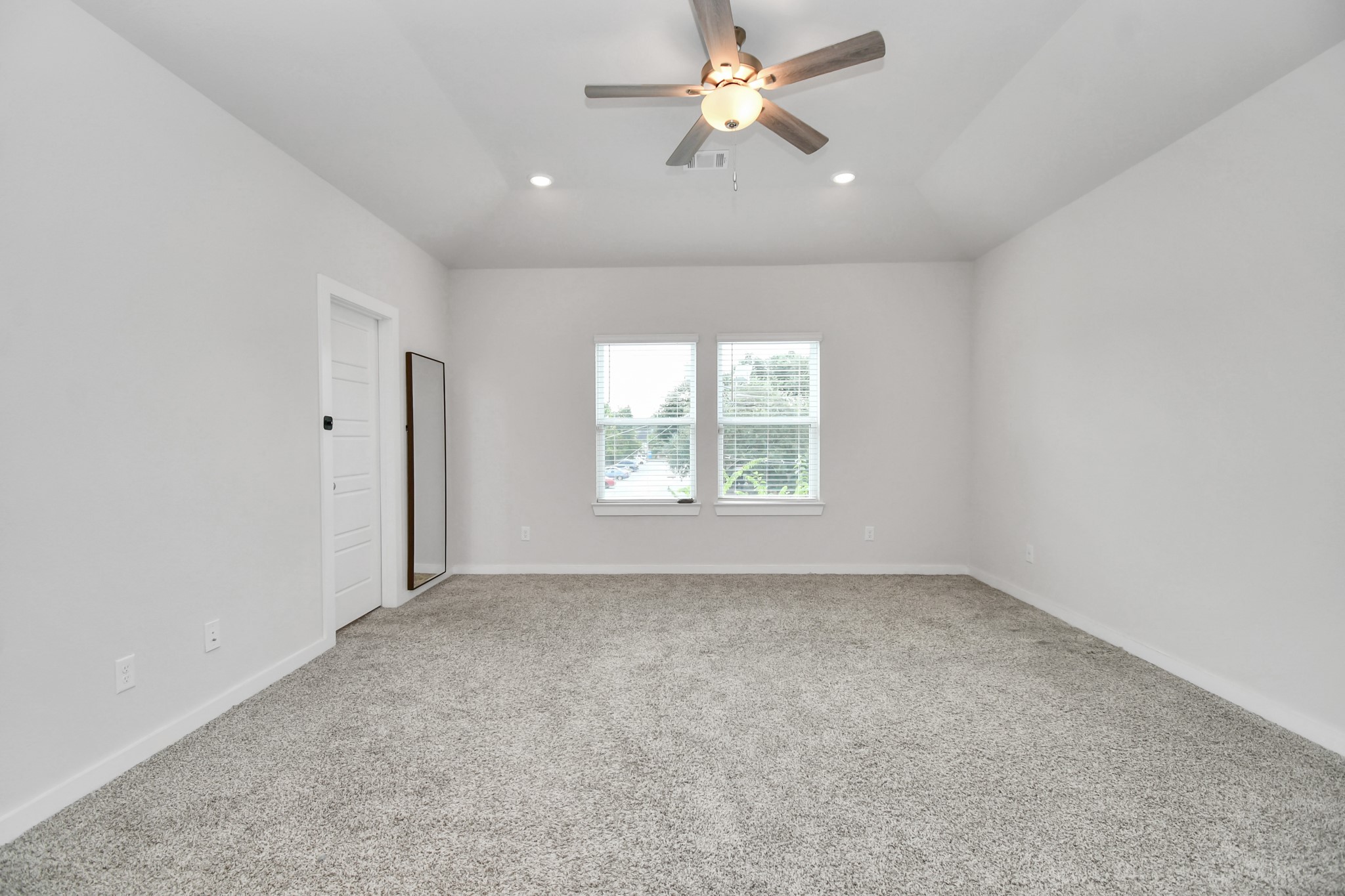 8213 Rising Stream Drive Houston, TX 77063 - Photo 8 of 21 an empty room with a window and a fan